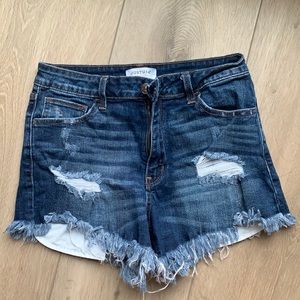 Distressed denim cutoffs